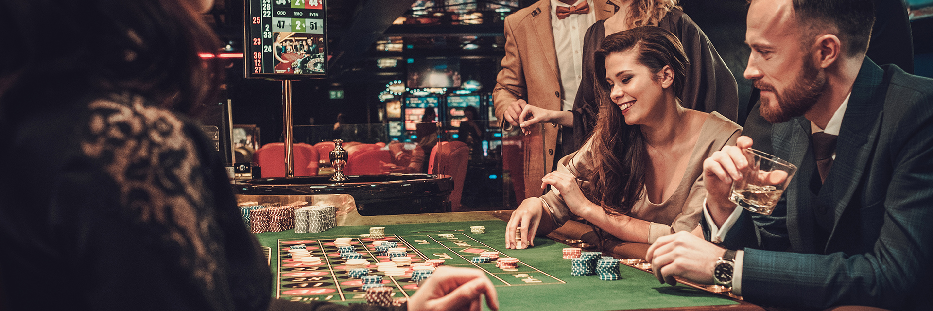 Image of people sitting around a casino table